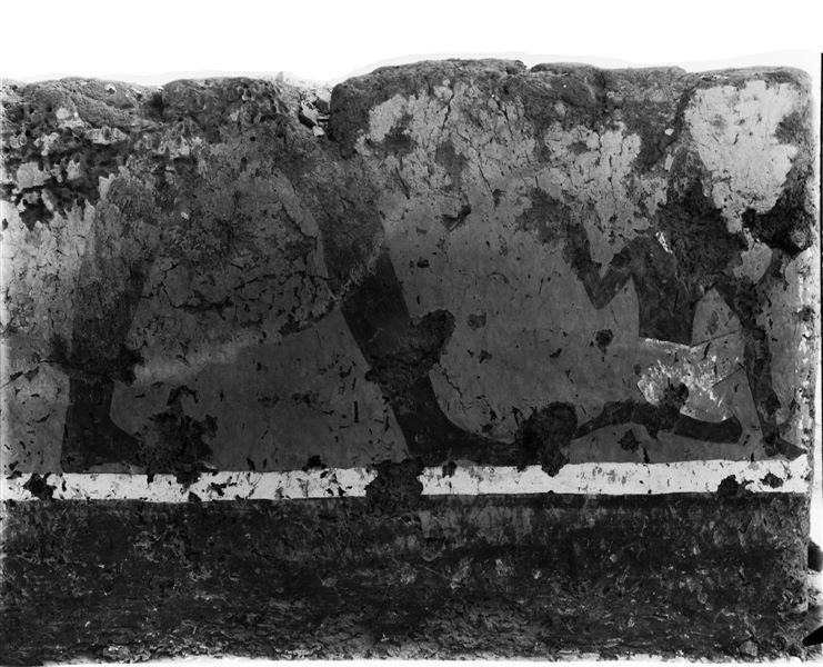 Tomb of Iti and Neferu. Pillar number 8. This painting presents an unusual scene depicting a standing figure leaning forward, holding a dark-skinned person by the hair, probably a prisoner from the southern regions of Egypt. Schiaparelli excavations. 