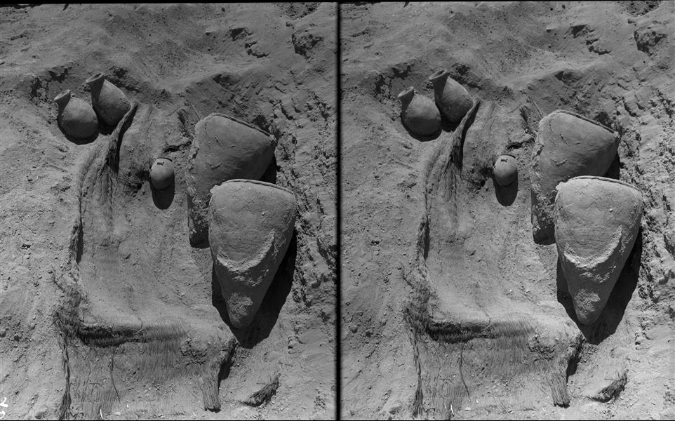 Burials scattered in the desert area north of the northern hill. Coming from the excavation; some vases of fine workmanship, placed near a basket (whose outlines can be seen) with the remains of the deceased inside. Farina excavations. 