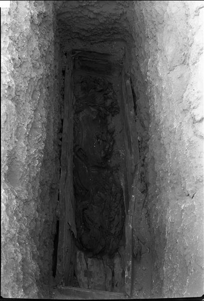 Burial in a rectangular coffin, with the mummy lying on its side. Schiaparelli excavations. 