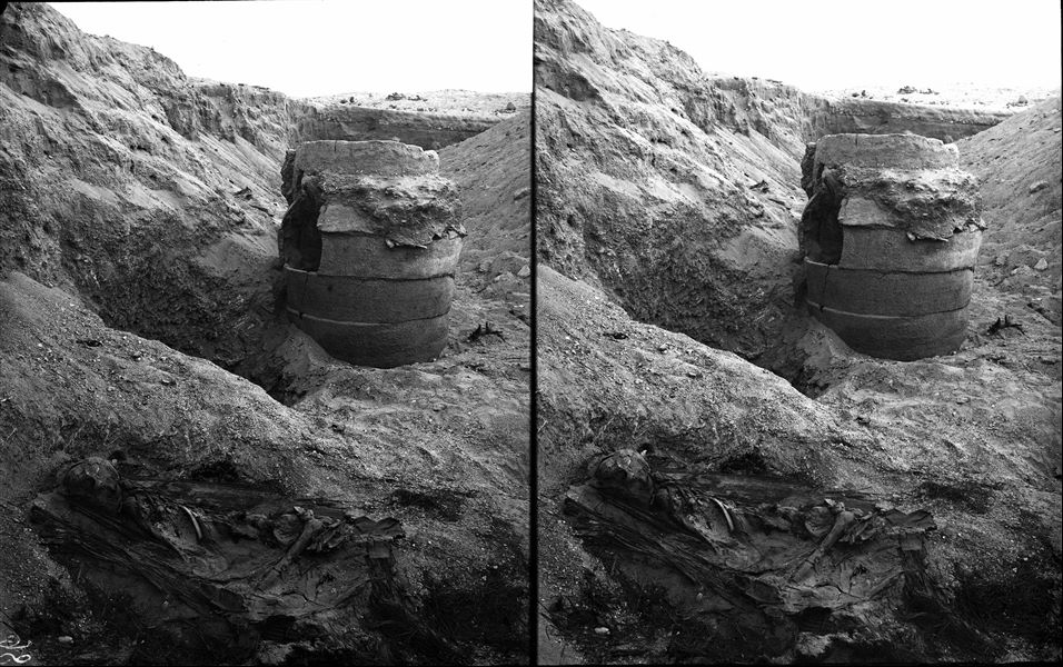 ​Scattered burials on the eastern slopes of the northern hill. In the foreground, a predynastic basket burial in a tightly contracted position. In the background, a large terracotta burial vase, consisting of several stacked circular ceramic pieces photographed at the moment of its discovery. Farina excavations. 