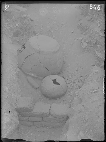 Scattered burials on the eastern slopes of the north hill. Overturned vases to protect human remains. Schiaparelli excavations. 