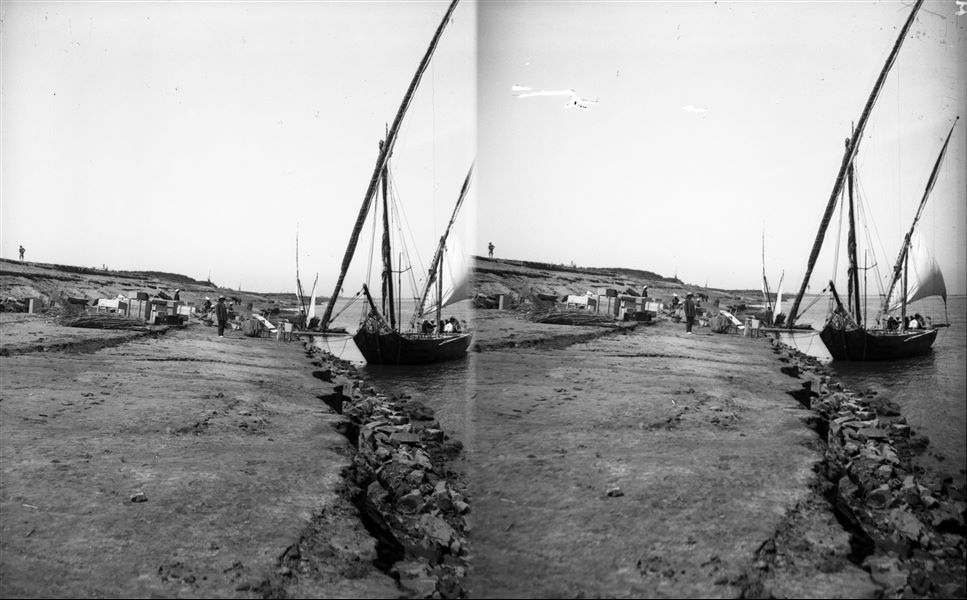 Every year at the end of the excavation season, not only the antiquities but the mission's materials were transferred to warehouses: tents, beds, furniture and various equipment. The antiquities remained in boxes sealed by the official from the Egyptian Antiquities Service. Here the finds would wait until the following year to be assigned either to the Cairo Museum or the museum in Turin. Giovanni Marro is visible in the centre of the picture. Schiaparelli excavations. 