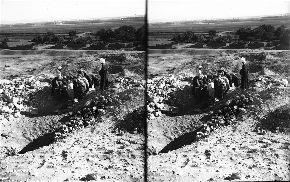 Excavated finds, after being packed and placed in sturdy crates specially built on the excavation site, were laboriously transported towards the valley by dozens of workers. Schiaparelli excavations. 