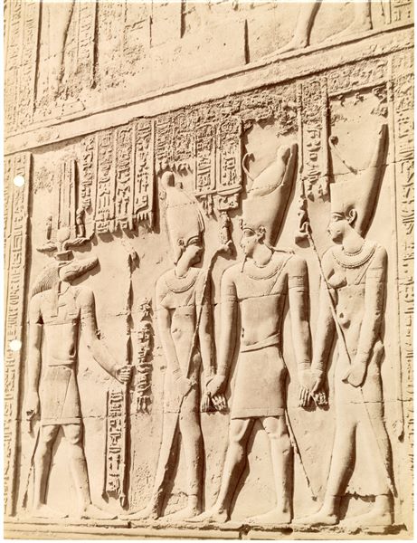 The photograph shows a sacred scene from the interior walls of the Temple of Sobek and Haroeris at Kom Ombo. 
