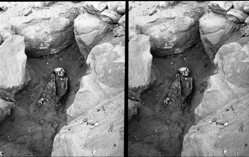Discovery of a skeleton surrounded by rock, presumably during excavations in Qubbet el-Hawa. Schiaparelli excavations.