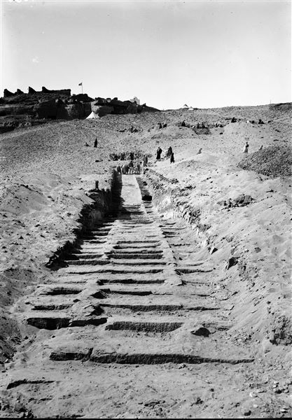Excavation of the ascending ramp of the tomb of Khunes (QH 34h). In the background; the tents of the mission. Schiaparelli excavations.