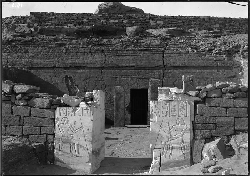 View of the courtyard entrance of the tomb of Sarenput I (QH 36), followed by the entrance to the rock-cut chambers. Schiaparelli excavations.