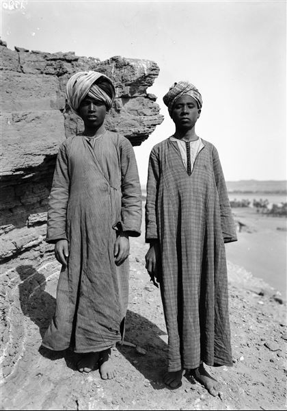 Egyptian couple photographed presumably near Qubbet el-Hawa, in the background, the Nile. Schiaparelli excavations. 