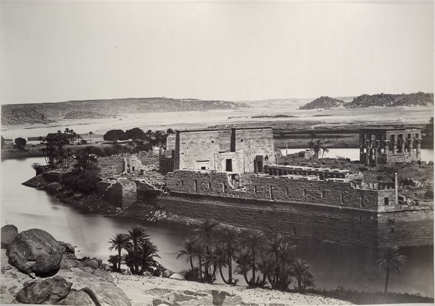 View of the island of Philae, where there is the temple complex dedicated to the goddess Isis. In the photograph the first pylon of the temple in the centre is clearly visible (behind this, the second pylon can be glimpsed), and on the right is Trajan’s Kiosk. The author's signature is visible at the bottom left.