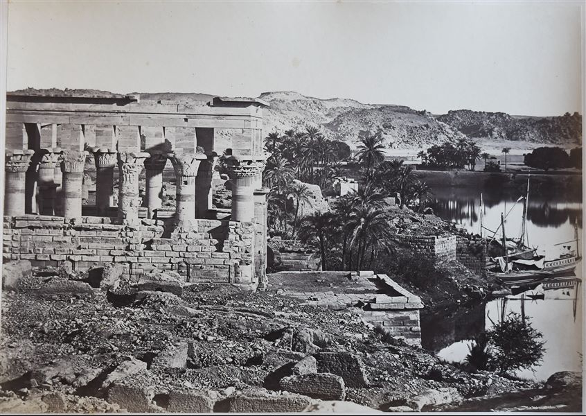 View of Trajan's Kiosk on the island of Philae. On the right, some feluccas are moored on the shore of the island. The author's signature is faintly visible on the left, among the gravel. 