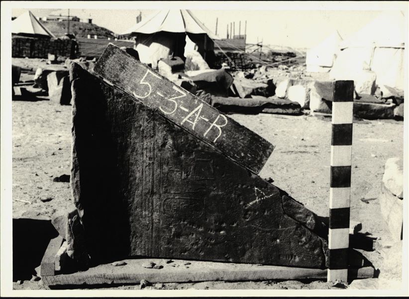 Storage at Wadi es-Sebua, one of the 66 blocks from the rock-cut chapel of Ellesiya stored waiting to be transported to Turin, after the United Arab Republic decided to gift the rock-cut chapel to the Italian Republic. Left wall of the chapel, depicting Pharaoh Tuthmosis III offering milk to the goddess Satet, who isn’t visible on this block.