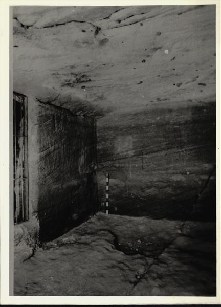 Photograph inside the rock-cut chapel of Ellesiya in its original location in Nubia, shortly before the Nile waters would begin to rise due to the construction of the Aswan Dam, which would flood the area. Photograph taken in the mid-1960s, shortly before the rock-cut chapel was moved. Note the original floor, which was not saved.