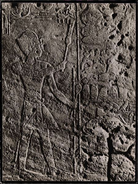 Photograph of a detail depicting Pharaoh Tuthmosis III, from an interior wall in the rock-cut chapel of Ellesiya. The rock-cut chapel is in its original location in Nubia, shortly before the Nile waters would begin to rise due to the construction of the Aswan Dam, which would flood the area. Photograph taken in the mid-1960s, shortly before the rock-cut chapel was moved.
