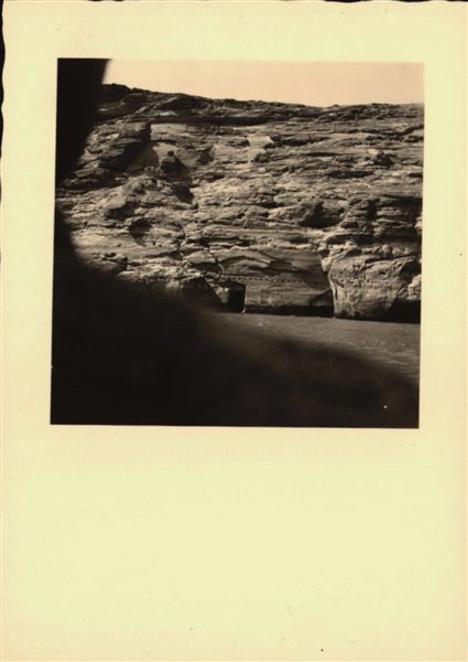 Photograph taken in the direction of the rock-cut rock-cut chapel of Ellesiya that can be seen in the background. In a short time, the rock-cut chapel would have been submerged by the growing Lake Nasser, which had already formed and was quite large. Photograph taken from a boat.