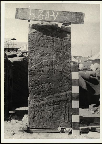 Storage at Wadi es-Sebua, one of the 66 blocks from the rock-cut chapel of Ellesiya stored waiting to be transported to Turin, after the United Arab Republic decided to gift the rock-cut chapel to the Italian Republic. Left sidewall of the transverse hall, with Tuthmosis III and the god Min.