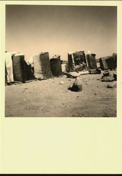 Storage at Wadi es-Sebua, where the rock-cut chapel of Ellesiya blocks were kept for a short time. Here they are arranged in rows waiting to be transferred to Turin after the United Arab Republic decided to gift the rock-cut chapel to the Italian Republic. 