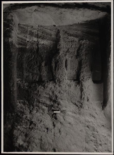 Photograph of the back niche in the rock-cut chapel of Ellesiya in its original location in Nubia, shortly before the Nile waters would begin to rise due to the construction of the Aswan Dam, which would flood the area. Photograph taken in the mid-1960s, shortly before the rock-cut chapel was moved. The three statues than can be seen in the image are carved into the rock and depict Horus of Miam, the goddess Satet, and in the centre, the ruler Tuthmosis III. 