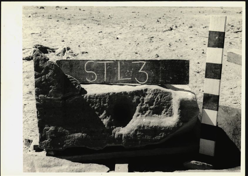 Storage at Wadi es-Sebua, one of the 66 blocks from the rock-cut chapel of Ellesiya stored waiting to be transported to Turin, after the United Arab Republic decided to gift the rock-cut chapel to the Italian Republic. Lower block of one of the stelae carved on the left side of the rock-cut chapels’ external façade.