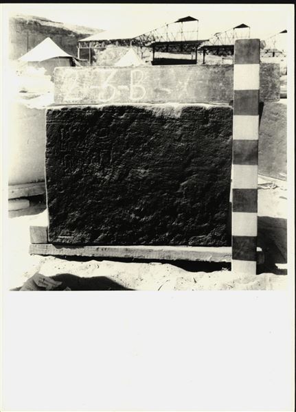 Storage at Wadi es-Sebua, one of the 66 blocks from the rock-cut chapel of Ellesiya stored waiting to be transported to Turin, after the United Arab Republic decided to gift the rock-cut chapel to the Italian Republic. Lower block from the left side of the back of the transverse hall, showing hieroglyphic inscriptions. 