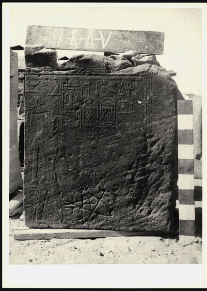 Storage at Wadi es-Sebua, one of the 66 blocks from the rock-cut chapel of Ellesiya stored waiting to be transported to Turin, after the United Arab Republic decided to gift the rock-cut chapel to the Italian Republic. Wall scene to the right of the transverse hall’s entrance, with the pharaoh on the right offering incense to the god Horus of Nekhen. At the bottom, there is an engraving of a five-pointed Judaic star, with a Christian cross incised within it. 