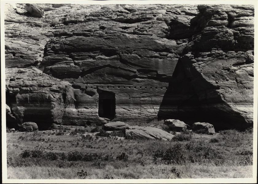 Photograph of the rock-cut rock-cut chapel of Ellesiya in its original location within the Nubian landscape. Photograph taken shortly before the flood-waters would begin to rise and submerge the rock-cut chapel, due to the construction of the Aswan Dam.