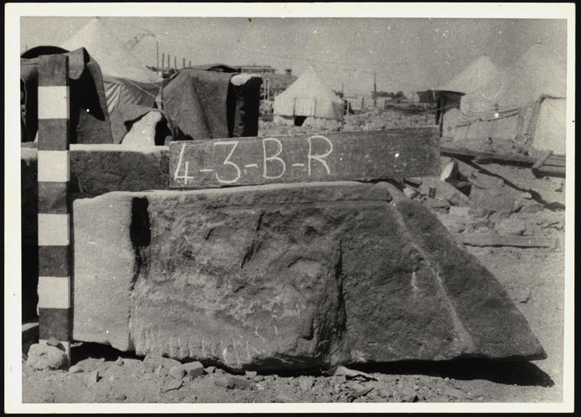Storage at Wadi es-Sebua, one of the 66 blocks from the rock-cut chapel of Ellesiya stored waiting to be transported to Turin, after the United Arab Republic decided to gift the rock-cut chapel to the Italian Republic. Block to be placed in the bottom of the chapel, at the foot of the three statues carved into the rock. 