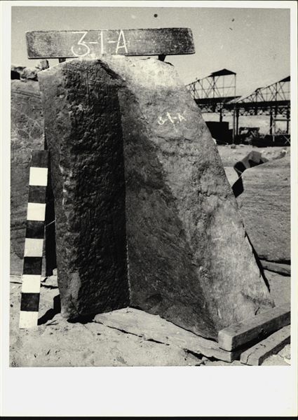 Storage at Wadi es-Sebua, one of the 66 blocks from the rock-cut chapel of Ellesiya stored waiting to be transported to Turin, after the United Arab Republic decided to gift the rock-cut chapel to the Italian Republic. Back wall forming a corner with the right wall of the chapel. A personified image of the southern Nile god is just visible on the back wall.