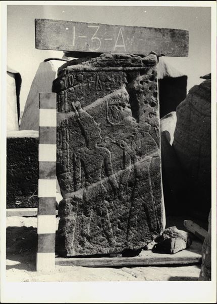 Storage at Wadi es-Sebua, one of the 66 blocks from the rock-cut chapel of Ellesiya stored waiting to be transported to Turin, after the United Arab Republic decided to gift the rock-cut chapel to the Italian Republic. Scene to the left of the transverse hall’s entrance, depicting the god Horus of Miam holding Pharaoh Tuthmosis III’s hand. 