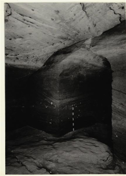 Photograph inside the rock-cut chapel of Ellesiya in its original location in Nubia, shortly before the Nile waters would begin to rise due to the construction of the Aswan Dam, which would flood the area. Photograph taken in the mid-1960s, shortly before the rock-cut chapel was moved. Note the original floor, which was not saved.