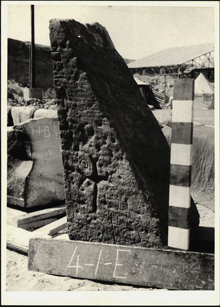 Storage at Wadi es-Sebua, one of the 66 blocks from the rock-cut chapel of Ellesiya stored waiting to be transported to Turin, after the United Arab Republic decided to gift the rock-cut chapel to the Italian Republic. The block shows a very clearly engraved Christian cross on the right side of the entrance to the rock-cut chapel, the wall facing the entrance. 
