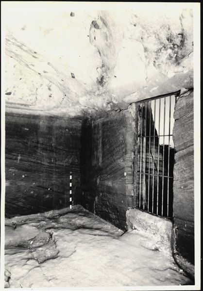Photograph of an interior wall from the rock-cut chapel of Ellesiya in its original location in Nubia, shortly before the Nile waters would begin to rise due to the construction of the Aswan Dam, which would flood the area. Photograph taken in the mid-1960s, shortly before the rock-cut chapel was moved. Note the original floor, which was not saved. Prior to the rock-cut chapel’s relocation, it was locked with a grate.