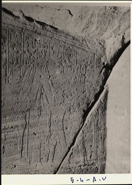 Photograph of an interior section from the rock-cut chapel of Ellesiya, shortly before it was moved. Photograph taken in the mid-1960s. Visible on the left wall of the transverse chamber: the god Min on the left, and on the right, the god Montu who embraces the pharaoh. 