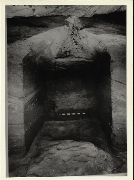 Photograph of the back niche in the rock-cut chapel of Ellesiya in its original location in Nubia, shortly before the Nile waters would begin to rise due to the construction of the Aswan Dam, which would flood the area. Photograph taken in the mid-1960s, shortly before the rock-cut chapel was moved. Note the original floor, which was not saved.