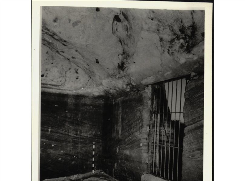 Photograph inside the rock-cut chapel of Ellesiya, where the statues of deities and the pharaoh were located. The rock-cut chapel is in its original location in Nubia, shortly before the Nile waters would begin to rise due to the construction of the Aswan Dam, which would flood the area. Photograph taken in the mid-1960s, shortly before the rock-cut chapel was moved. Note the original floor, which was not saved. Prior to the rock-cut chapel’s relocation, it was locked with a grate.