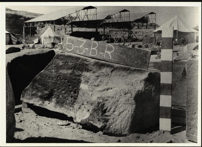 Storage at Wadi es-Sebua, one of the 66 blocks from the rock-cut chapel of Ellesiya stored waiting to be transported to Turin, after the United Arab Republic decided to gift the rock-cut chapel to the Italian Republic. Lower block at the corner of the left wall and the bottom of the chapel.  