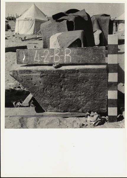 Storage at Wadi es-Sebua, one of the 66 blocks from the rock-cut chapel of Ellesiya stored waiting to be transported to Turin, after the United Arab Republic decided to gift the rock-cut chapel to the Italian Republic. Lower block from the right wall of the chapel. 