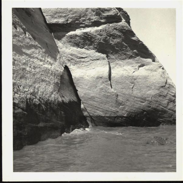 Photograph of the side facade wall from the rock-cut chapel of Ellesiya, showing the rising waters of Lake Nasser, which in a short time would have submerged the entire rock-cut chapel. Photograph taken from a boat. 