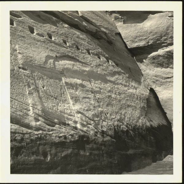 Photograph of the façade (right side) of the rock-cut rock-cut chapel of Ellesiya, during the rising of Lake Nasser, which would have submerged this area. As can be seen at the bottom right, the water had already reached the rock-cut chapel’s façade. 