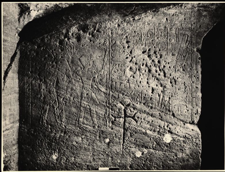 Photograph of a wall from the rock-cut chapel of Ellesiya in its original location in Nubia, shortly before the Nile waters would begin to rise due to the construction of the Aswan Dam, which would flood the area. Photograph taken in the mid-1960s, shortly before the rock-cut chapel was moved.