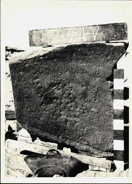 Storage at Wadi es-Sebua, one of the 66 blocks from the rock-cut chapel of Ellesiya stored waiting to be transported to Turin, after the United Arab Republic decided to gift the rock-cut chapel to the Italian Republic. Scene on the back left wall of the transverse hall, showing the god Amun-Re seated on a throne in front of a pile of offerings.