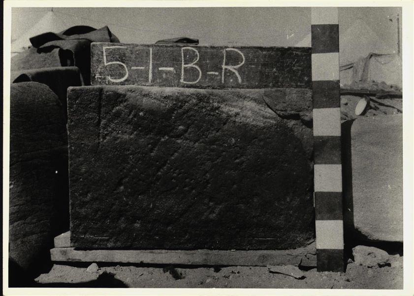 Storage at Wadi es-Sebua, one of the 66 blocks from the rock-cut chapel of Ellesiya stored waiting to be transported to Turin, after the United Arab Republic decided to gift the rock-cut chapel to the Italian Republic. Scene depicting the Viceroy Setau praying to Amun-Re and Horus, right wall of the chapel. 