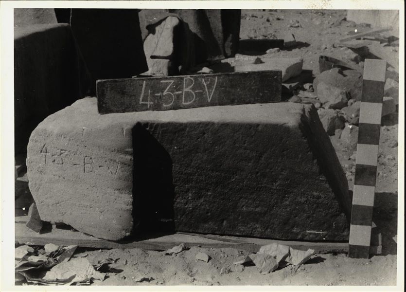 Storage at Wadi es-Sebua, one of the 66 blocks from the rock-cut chapel of Ellesiya stored waiting to be transported to Turin, after the United Arab Republic decided to gift the rock-cut chapel to the Italian Republic. Lower block from the right wall of the transverse hall forming a corner with the right side of the transverse hall’s back wall.