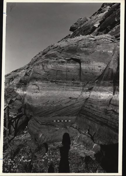 Photograph of a wall from the rock-cut chapel of Ellesiya still in its original location in Nubia, shortly before the Nile waters would begin to rise due to the construction of the Aswan Dam, which would flood the area. Photograph taken in the mid-1960s, shortly before the rock-cut chapel was moved.