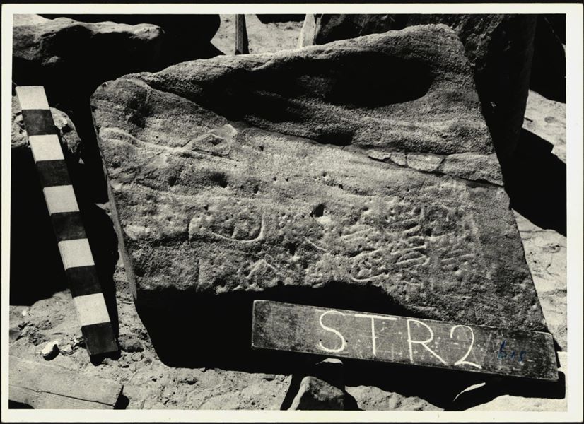 Storage at Wadi es-Sebua, one of the 66 blocks from the rock-cut chapel of Ellesiya stored waiting to be transported to Turin, after the United Arab Republic decided to gift the rock-cut chapel to the Italian Republic. Lower block of the so-called Restoration Stela. 