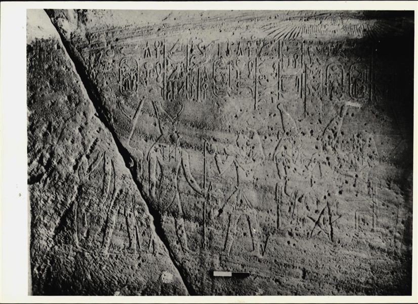 Photograph of an interior section from the rock-cut chapel of Ellesiya, shortly before it was moved. Photograph taken in the mid-1960s. Scene with several deities, on the right side of the transverse chamber. An engraved five-pointed star is also visible. 