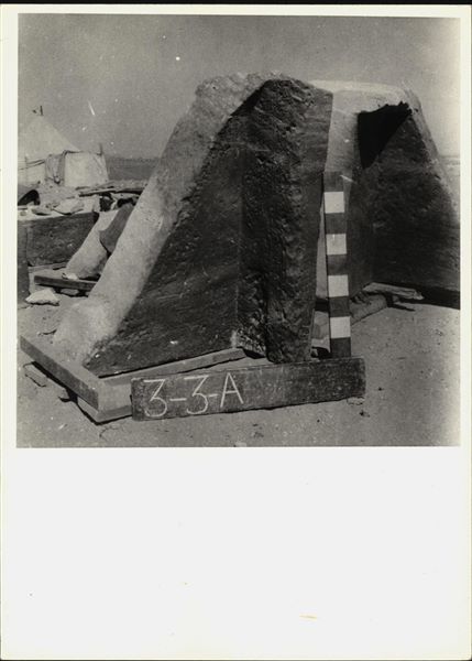 Storage at Wadi es-Sebua, one of the 66 blocks from the rock-cut chapel of Ellesiya stored waiting to be transported to Turin, after the United Arab Republic decided to gift the rock-cut chapel to the Italian Republic. Left wall of the chapel, forming a corner with the back of the chapel, with a depiction of the goddess Satet.  