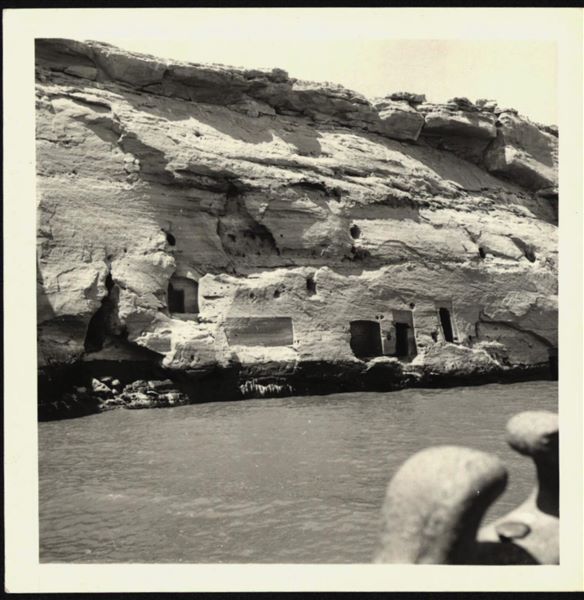 Photograph taken in the area of the rock-cut chapel in Qasr Ibrim, where some rooms and openings carved into the rock can be seen. 