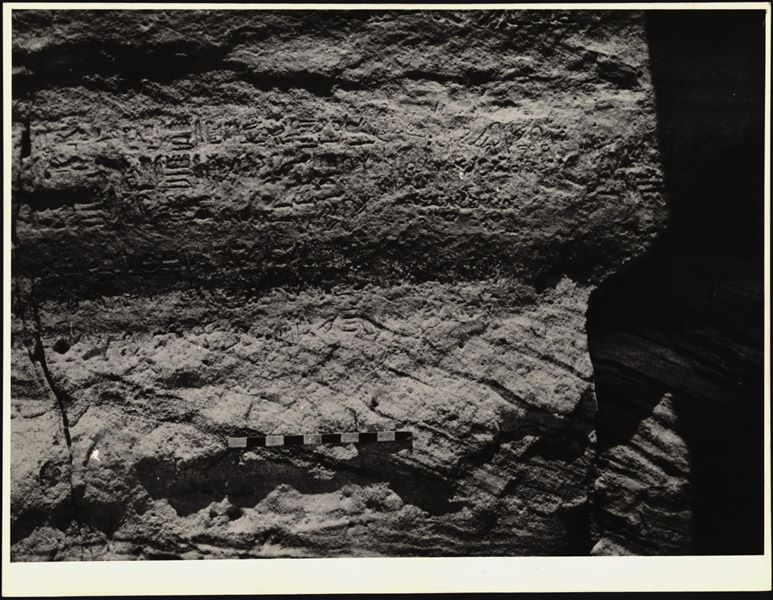 Photograph of a wall from the rock-cut chapel of Ellesiya in its original location in Nubia, shortly before the Nile waters would begin to rise due to the construction of the Aswan Dam, which would flood the area. Photograph taken in the mid-1960s, shortly before the rock-cut chapel was moved.