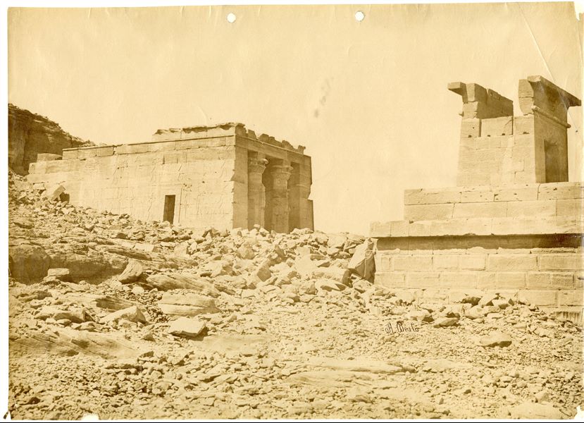 View of the remains of the Roman temple of Dendur, in its original location, dedicated to Isis, Osiris and two deified sons of a local Nubian ruler, Pihor and Pedesi. Due to the temple’s risk of submersion after the construction of the Aswan Dam and the rising Lake Nasser, it was removed in 1963 and then donated by the egyptian government to the United States for their aid and assistance in saving the Nubian temples and documenting the area. Today it is housed in the Metropolitan Museum of Art (The MET), New York. The author's signature is at the bottom right. 