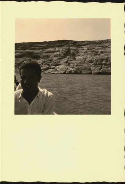 Photograph taken in the direction of the rock-cut Temple of Ellesiya that can be seen in the background. In a short time, the temple would have been submerged by Lake Nasser, which had already formed and was full. Photograph taken from a boat.